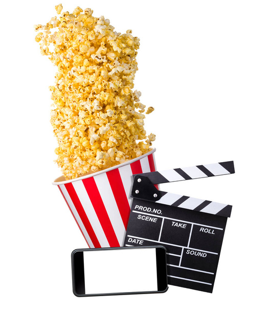Flying popcorn, film clapper board and phone isolated on white background - 写真・画像