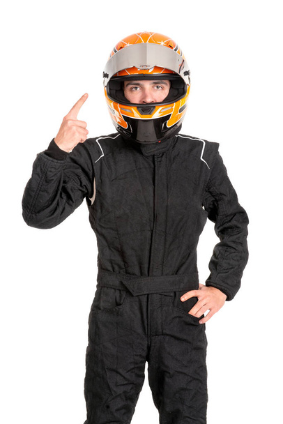 Victorious racing driver posing with helmet isolated in white - Foto, afbeelding