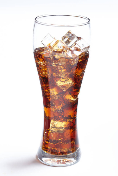 cola with ice cubes in glass, close view   - Фото, изображение