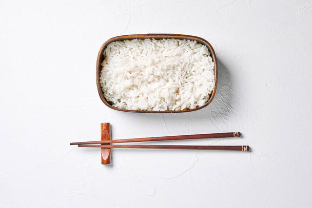 bento box with rice and chopsticks. - Fotó, kép