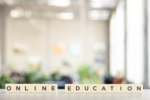 white blocks with online education lettering on white desk - Photo, Image