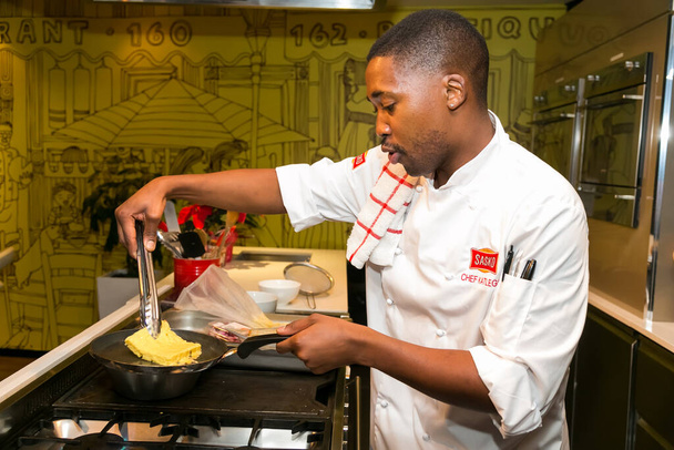 Johannesburg, South Africa - November 10, 2016: Young African Chef demonstrating various techniques at cooking class - 写真・画像