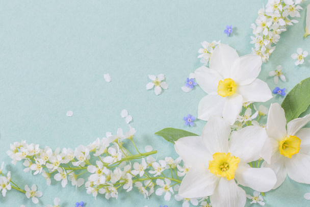 white spring flowers on paper background - Fotó, kép