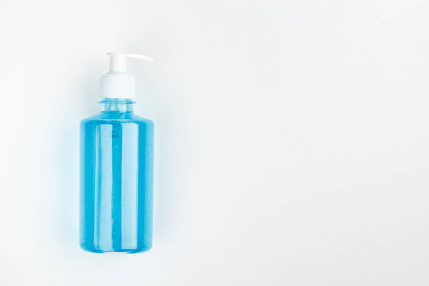 Bottle of blue antiseptic on a white background - Foto, imagen