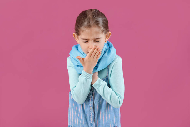 Sick little girl on color background - Photo, Image