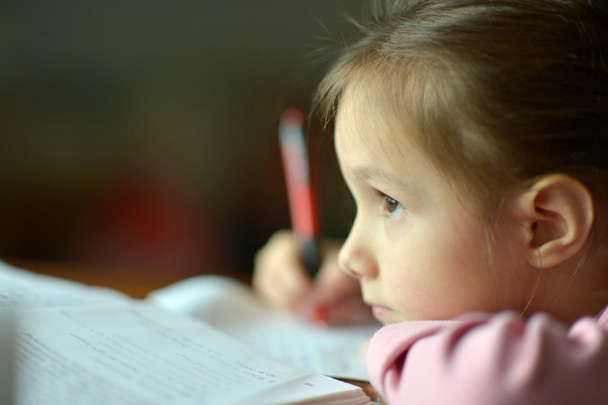 Little girl writing - Фото, изображение