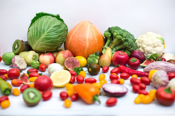 Collection of fresh vegetables on the kitchen table. Healthy food. - Photo, Image