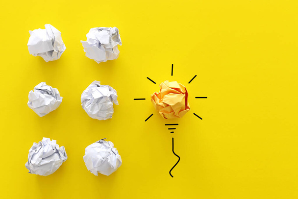 Education concept image. Creative idea and innovation. Crumpled paper as light bulb metaphor - Foto, Imagem