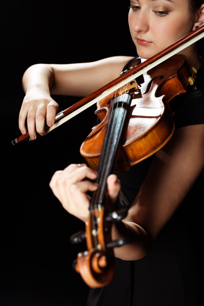 attractive professional musician playing symphony on violin isolated on black - Foto, Imagem