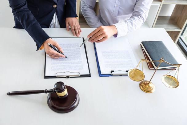 Professional female lawyer or counselor discussing negotiation legal case with client meeting with document contract in office, law and justice, attorney, lawsuit concept. - Fotoğraf, Görsel