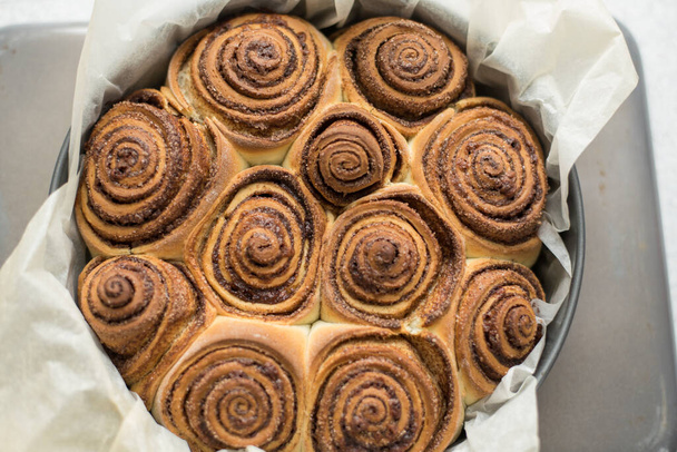 Fresh rolls rolls with Cinnamon in the form of. Flavorful pastries. - Fotó, kép
