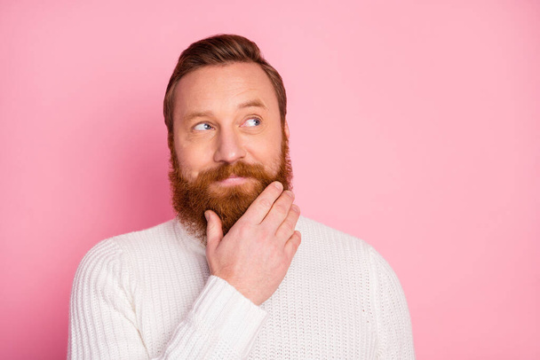 Close-up portrait of his he nice attractive creative curious red guy touching beard thinking creating new decision solution isolated over pink pastel color background - Foto, Imagen