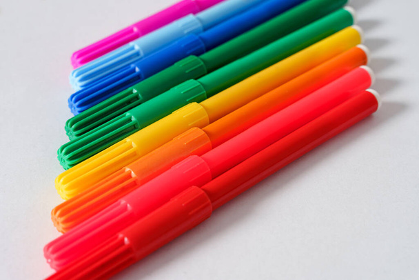 Colored markers on a white sheet. - Photo, Image