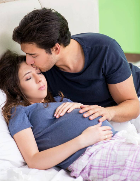 Young husband looking after his pregnant wife - Photo, Image