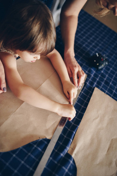 Mom and daughter sew clothes together. Pattern dress. - Photo, Image