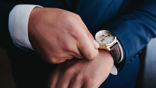 close up of an expensive elegant watch in hand. - Fotó, kép