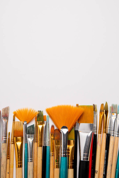 different brushes and paintbrushes on white background - Photo, image