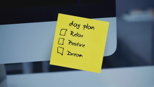 Sticky notes. Day plan. The inscription on the sticker on the monitor. Message. Motivation. Reminder. Handwritten text written with a marker. Color sticker. A message for an employee, a colleague. - Footage, Video