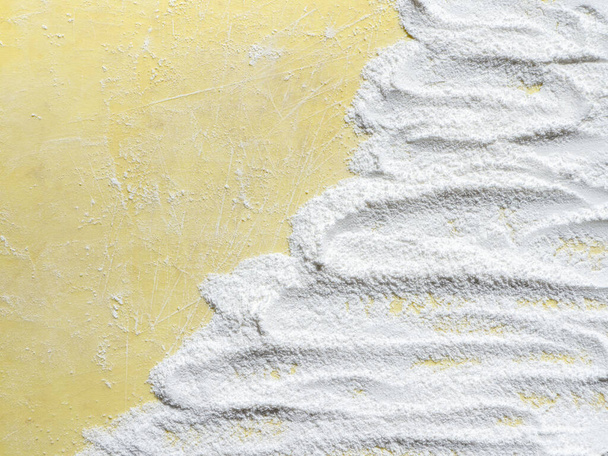 Baking background with flour and copy space on yellow surface for your text - Photo, Image