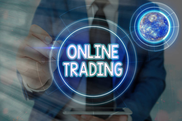 Conceptual hand writing showing Online Trading. Business photo showcasing Buying and selling assets via a brokerage internet platform Elements of this image furnished by NASA. - Photo, Image
