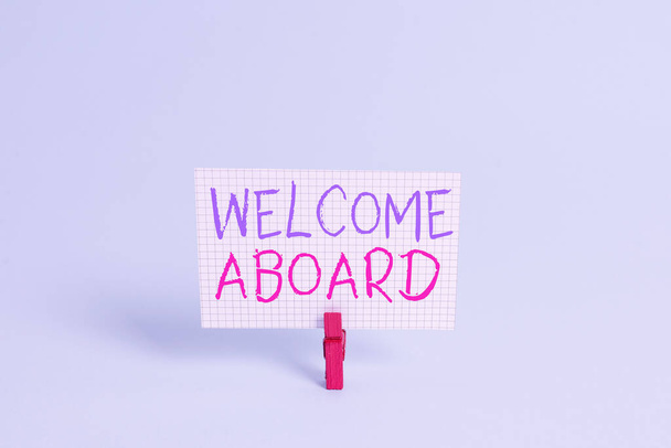 Conceptual hand writing showing Welcome Aboard. Business photo showcasing Expression of greetings to an individual whose arrived is desired Colored clothespin rectangle shaped paper blue background. - Photo, Image