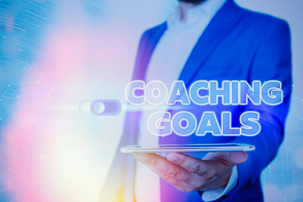Texte manuscrit Coaching Goals. Signification du concept Donner aux individus les moyens de prendre leurs responsabilités
. - Photo, image