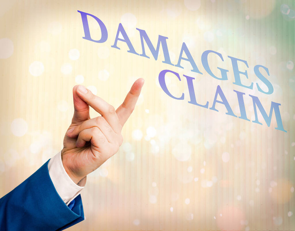 Writing note showing Damages Claim. Business photo showcasing Demand Compensation Litigate Insurance File Suit. - Photo, Image