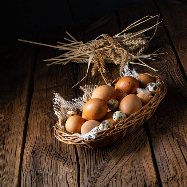 Fresh eggs straight from the farm in a basket - 写真・画像