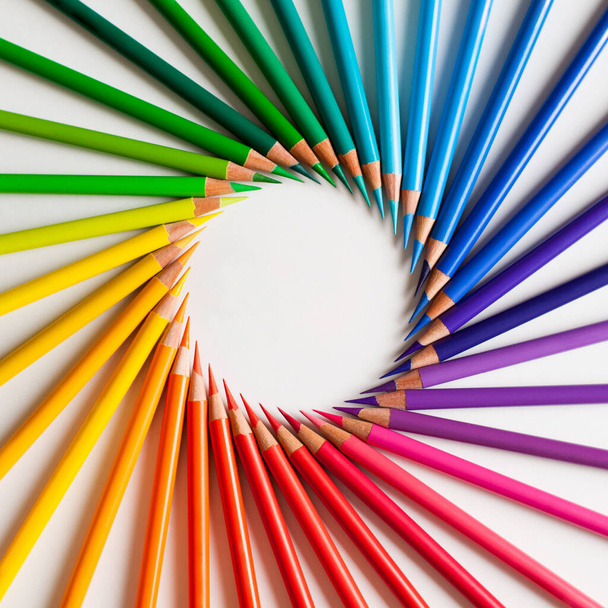 Crayons - colored pencil set loosely arranged  on white background. Round frame. - Photo, Image