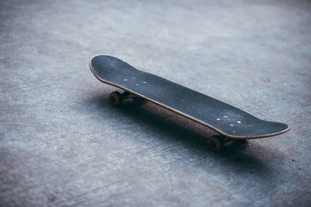 black skateboard ready for riding at outdoors - Fotó, kép