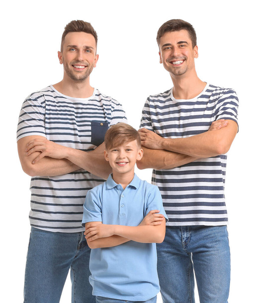 Happy gay couple with adopted child on white background - Фото, изображение