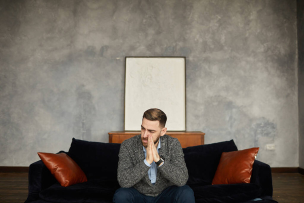 Disappointed businessman on the sofa - Foto, imagen