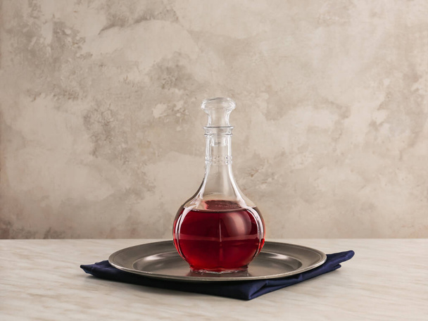 Decanter of wine on table - Valokuva, kuva
