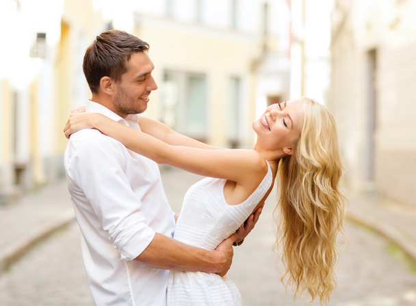 Smiling couple dancing in the city - Photo, Image