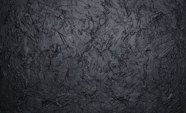 Textur aus schwarzem Stein, dunkler Schieferhintergrund, Draufsicht - Foto, Bild
