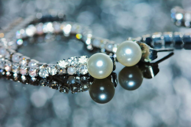 beautiful pearl earrings of woman in macro for background - Photo, Image