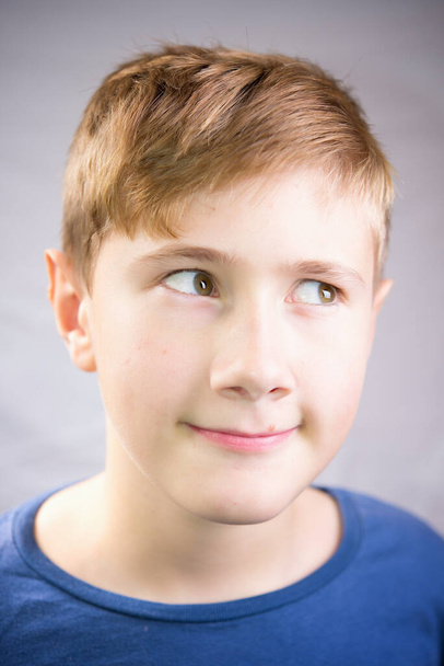 Emotional portrait of a 10-12 years boy. Emotional Portrait of thinking. - Фото, зображення