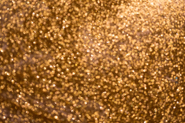golden glitter bokeh texture with place for text: christmas, celebration, party, invitation abstract background - Photo, Image