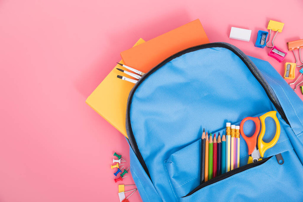 Blue bag backpack for education children on pink background back to school concept - Φωτογραφία, εικόνα