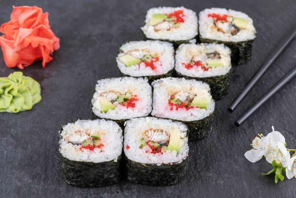 Sushi roll sushi with prawn, avocado, cream cheese, sesame. Sushi menu. Japanese food. - Photo, Image