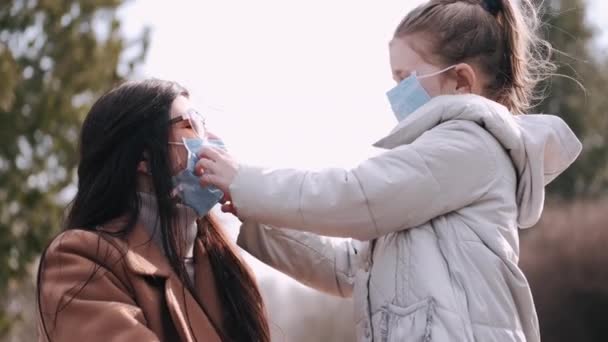 Mother and daughter are wearing disposable masks - Footage, Video