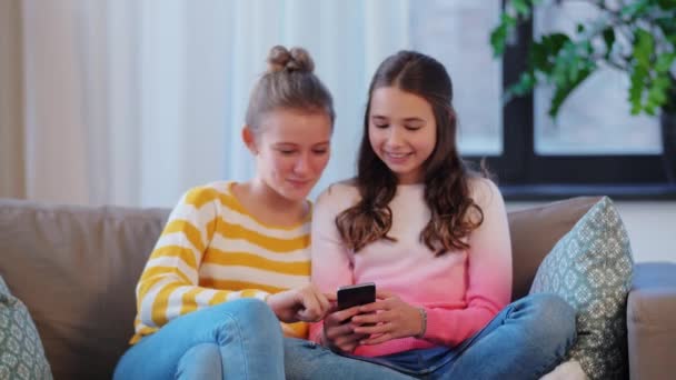 happy teenage girls with tablet computer at home - Materiaali, video