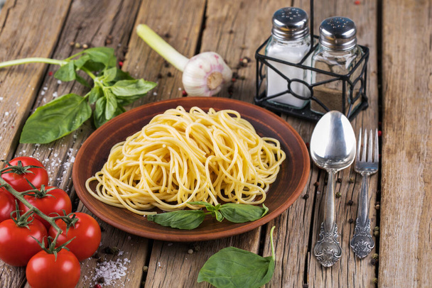 Delicious spaghetti with bacon and egg called alla carbonara on wooden table - Photo, Image