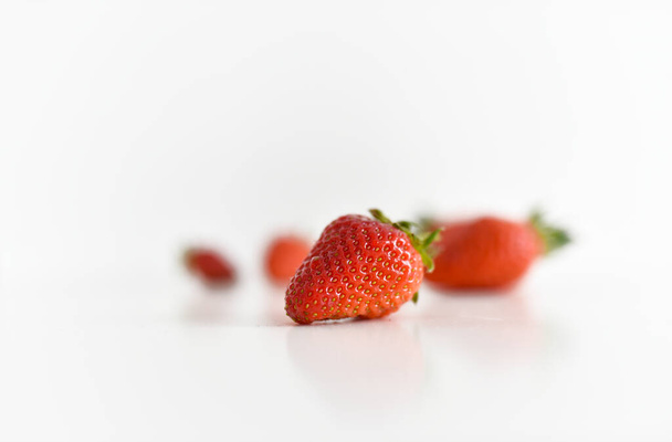 fresh strawberries bright red new crop on a white background - Фото, изображение