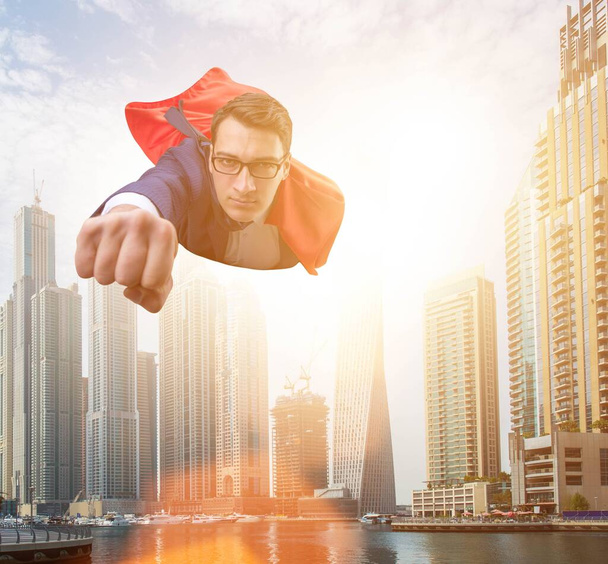 Супергерой бізнесмен літає над містом
 - Фото, зображення