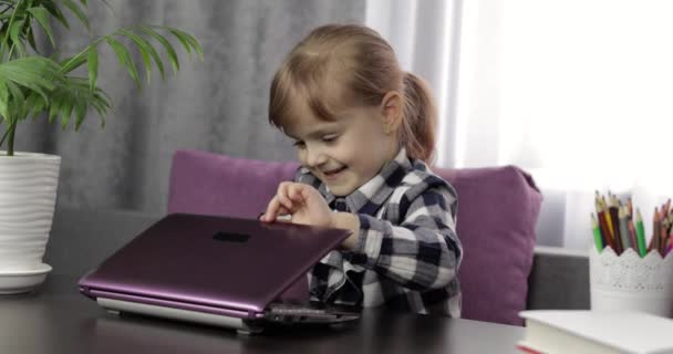 Girl studying online lessons using digital laptop computer. Distance education - Video, Çekim