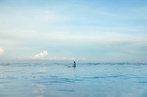 Surf In Ocean. Surfing Girl On Surfboard Swimming In Sea. Surfer In Blue Wetsuit Practicing On Waves. Water Sport At Beautiful Seaspace. - Фото, изображение