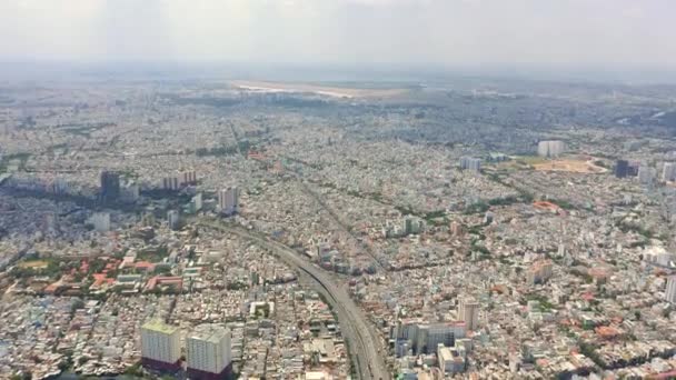 HOCHIMINH, VIETNAM - APRIL, 2020: Aerial panorama view of the cityscape of densely populated Hochiminh. - Filmmaterial, Video