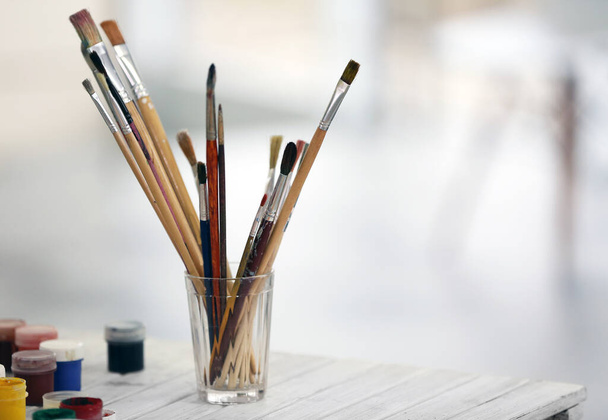 Drawing set with brushes and paints on white table - Photo, Image