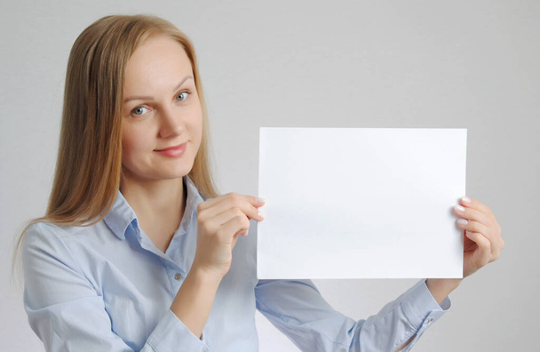 blonde girl with paper sheet. Poster or banner with copy-space concept - Foto, Imagem